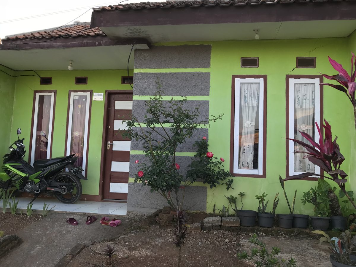 A row of newly built, brightly painted affordable homes